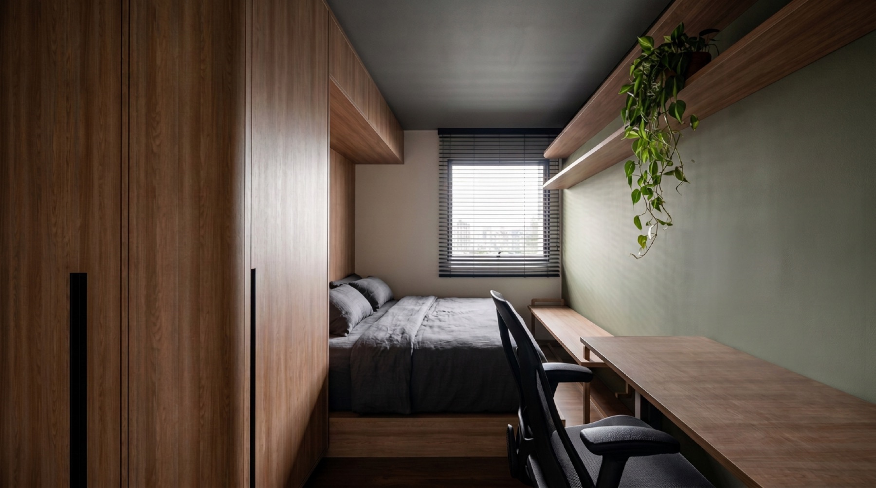 Quarto compacto com marcenaria e espaço de trabalho